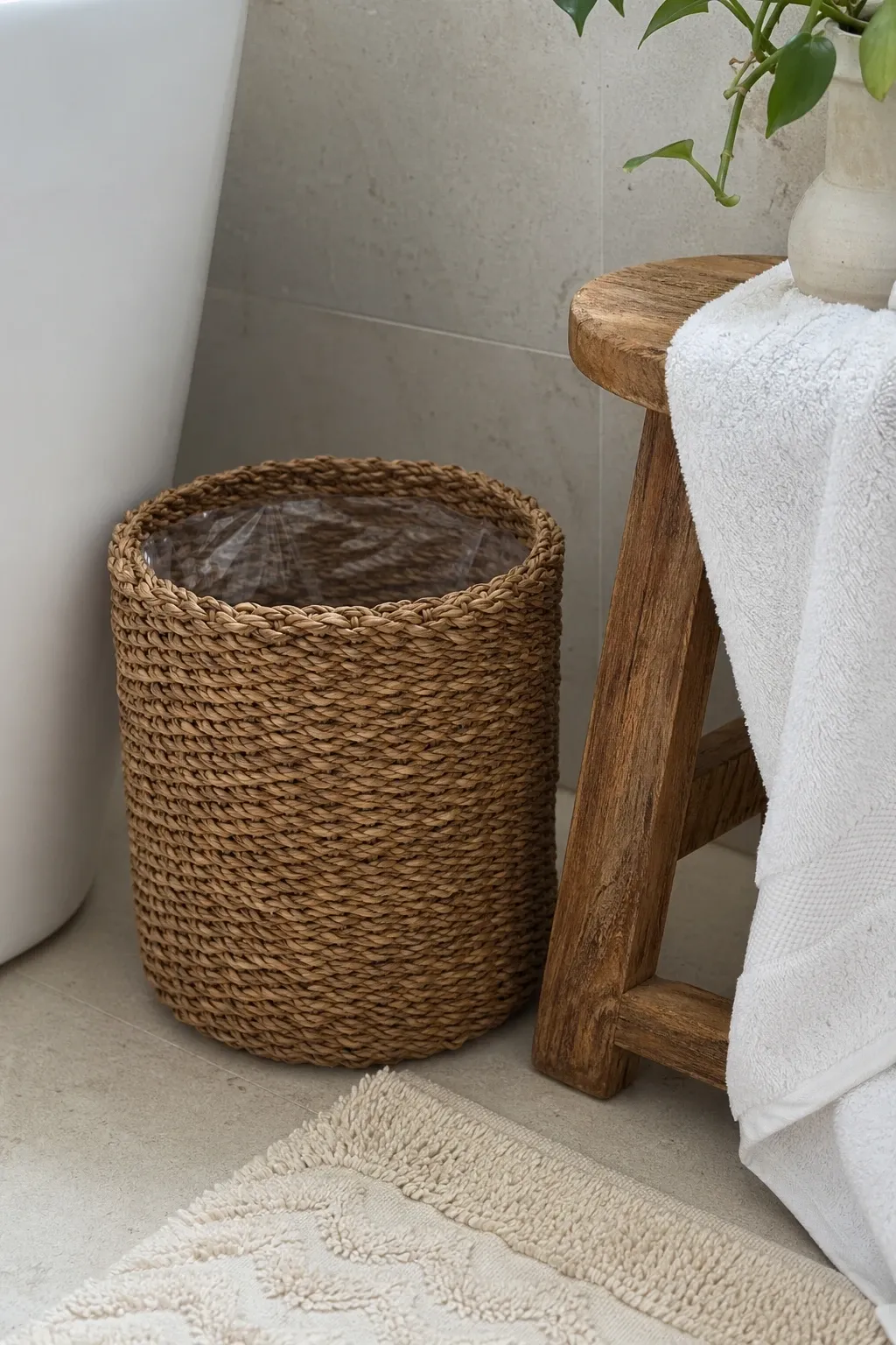 brushed gold or brass can in a bathroom