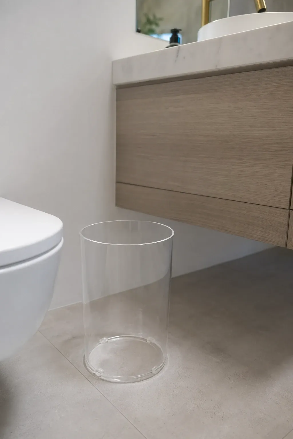 fabric-covered waste basket in a bathroom
