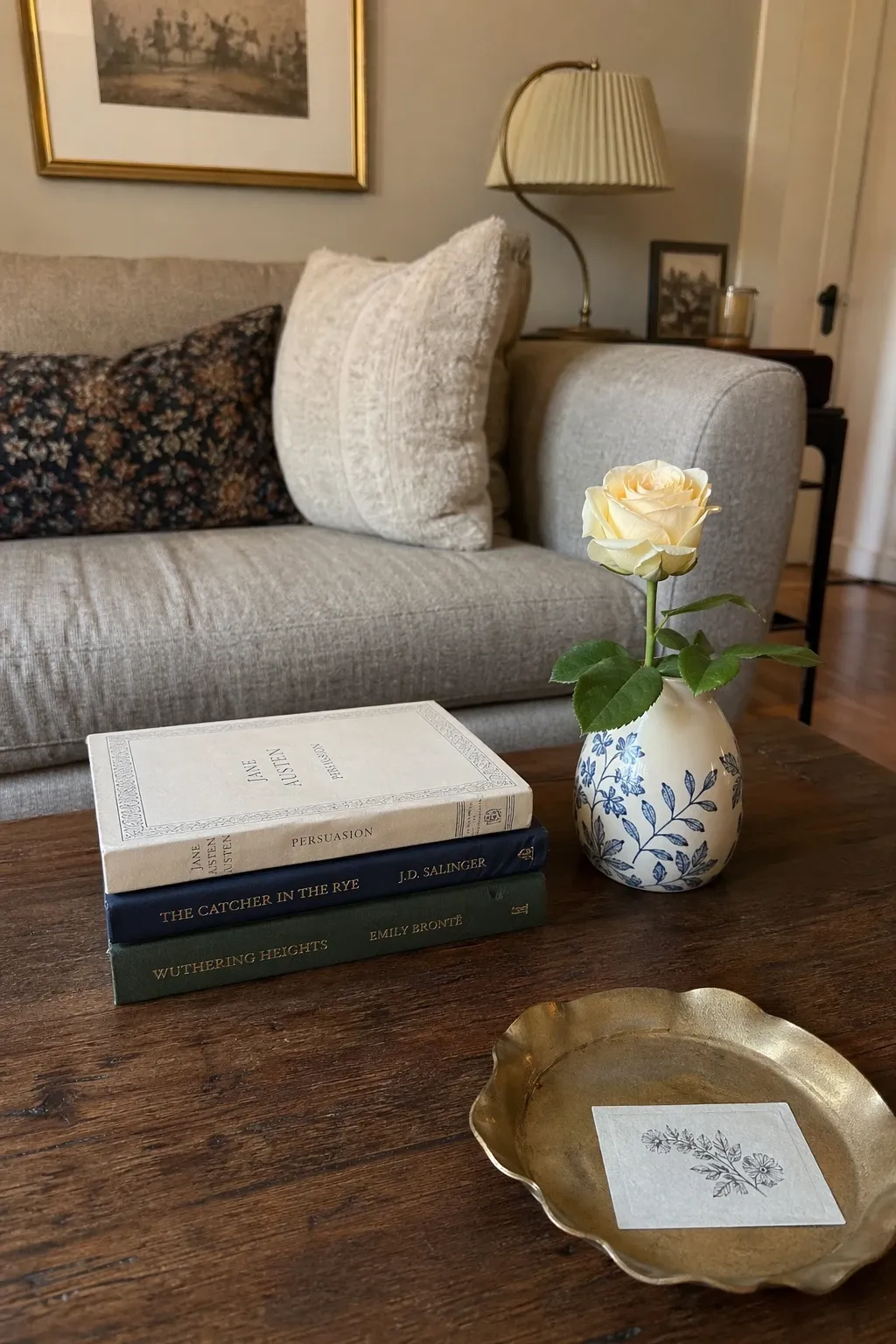 stacked books with a small vase