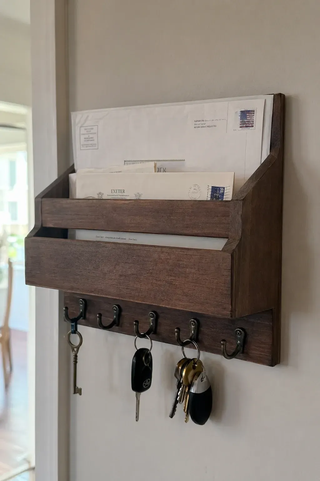key holder with mail sorter in a entryway