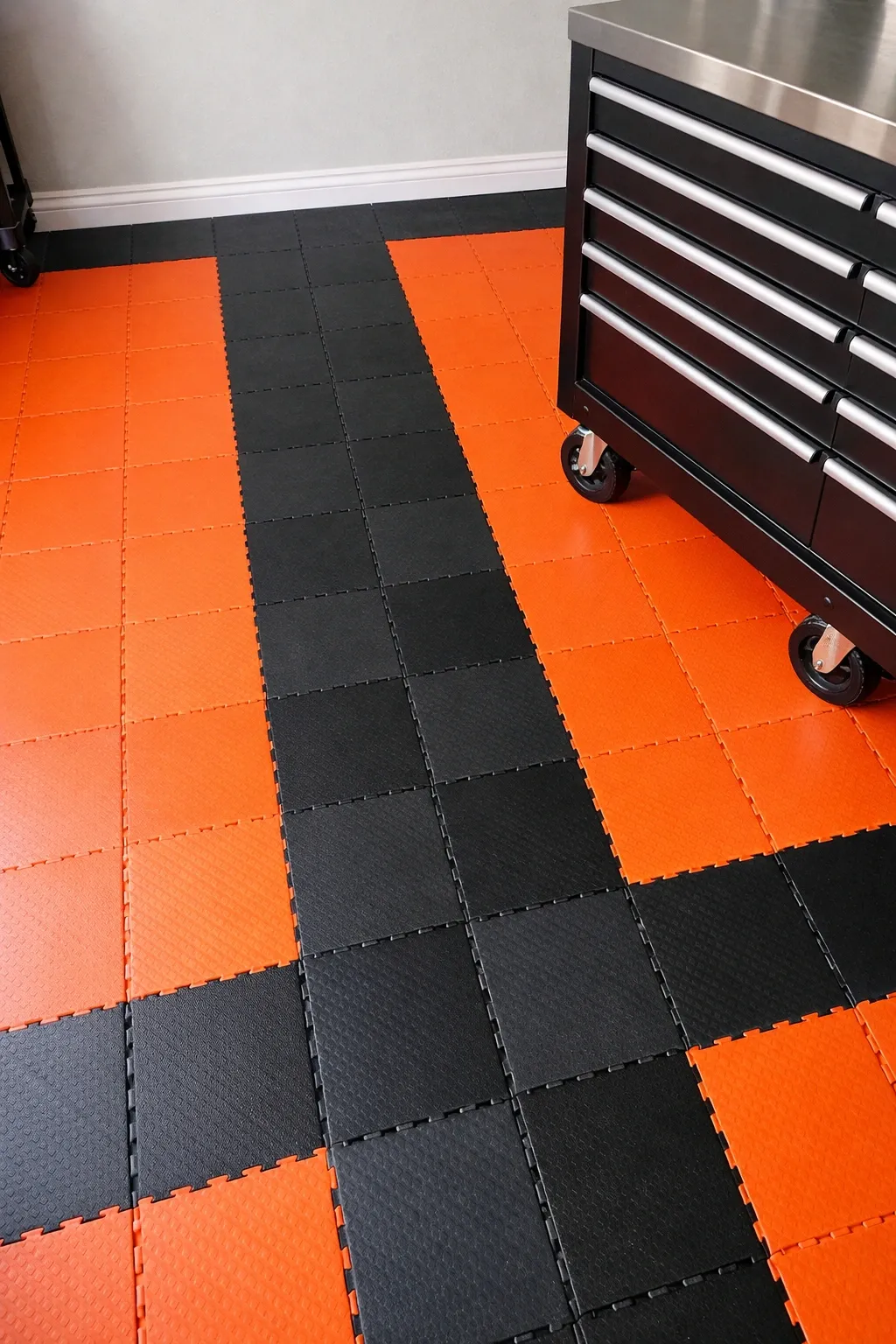 orange and black modular tiles in a garage