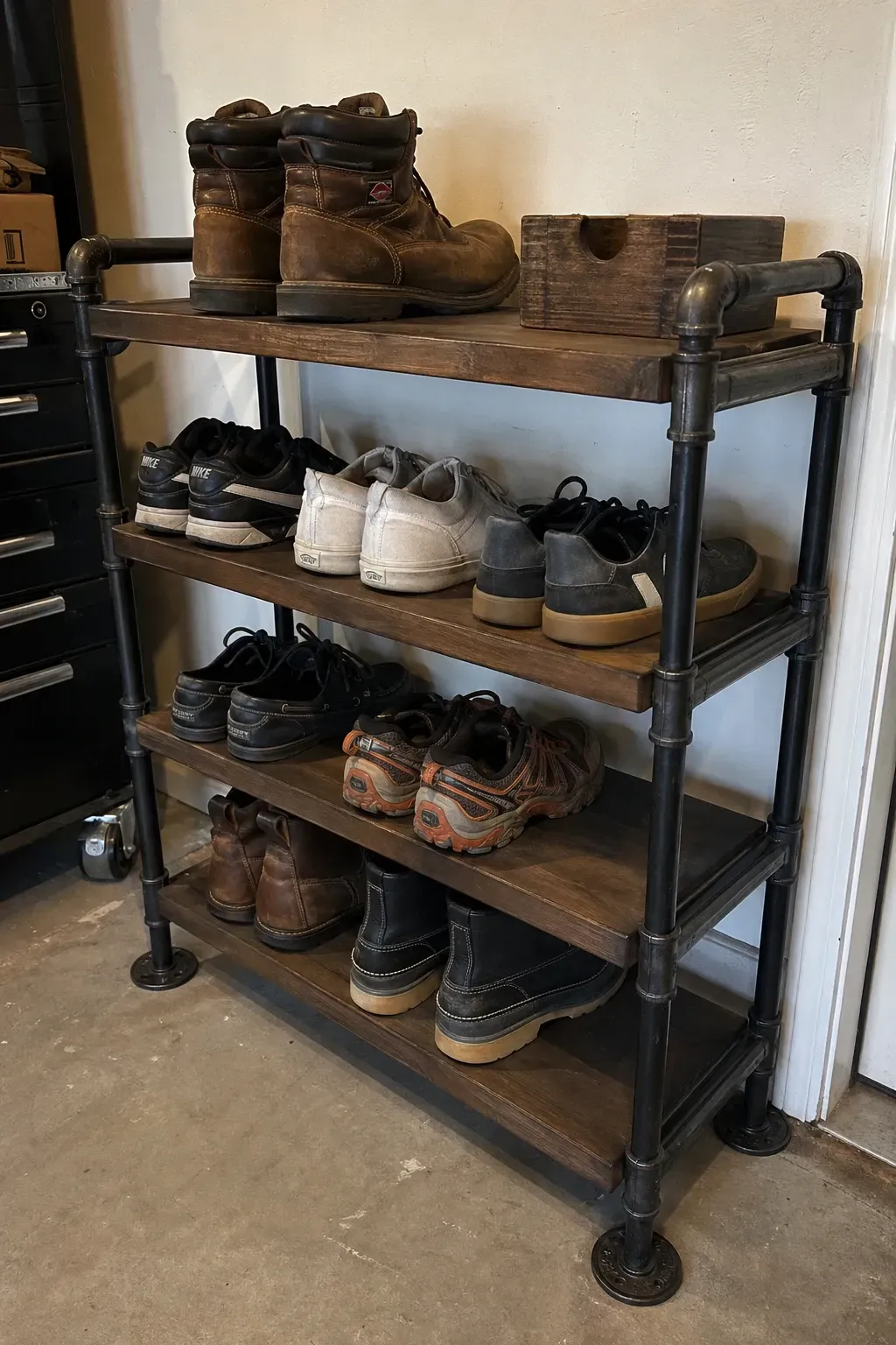 industrial pipe shoe rack in a garage