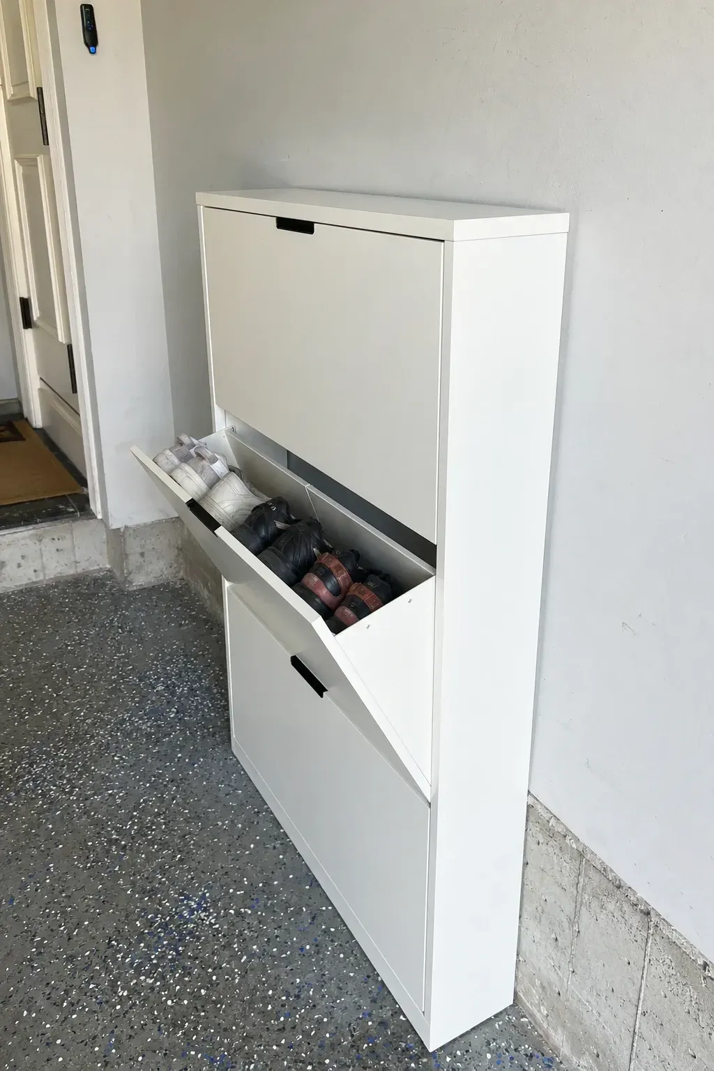 tilt-out shoe cabinet in a garage