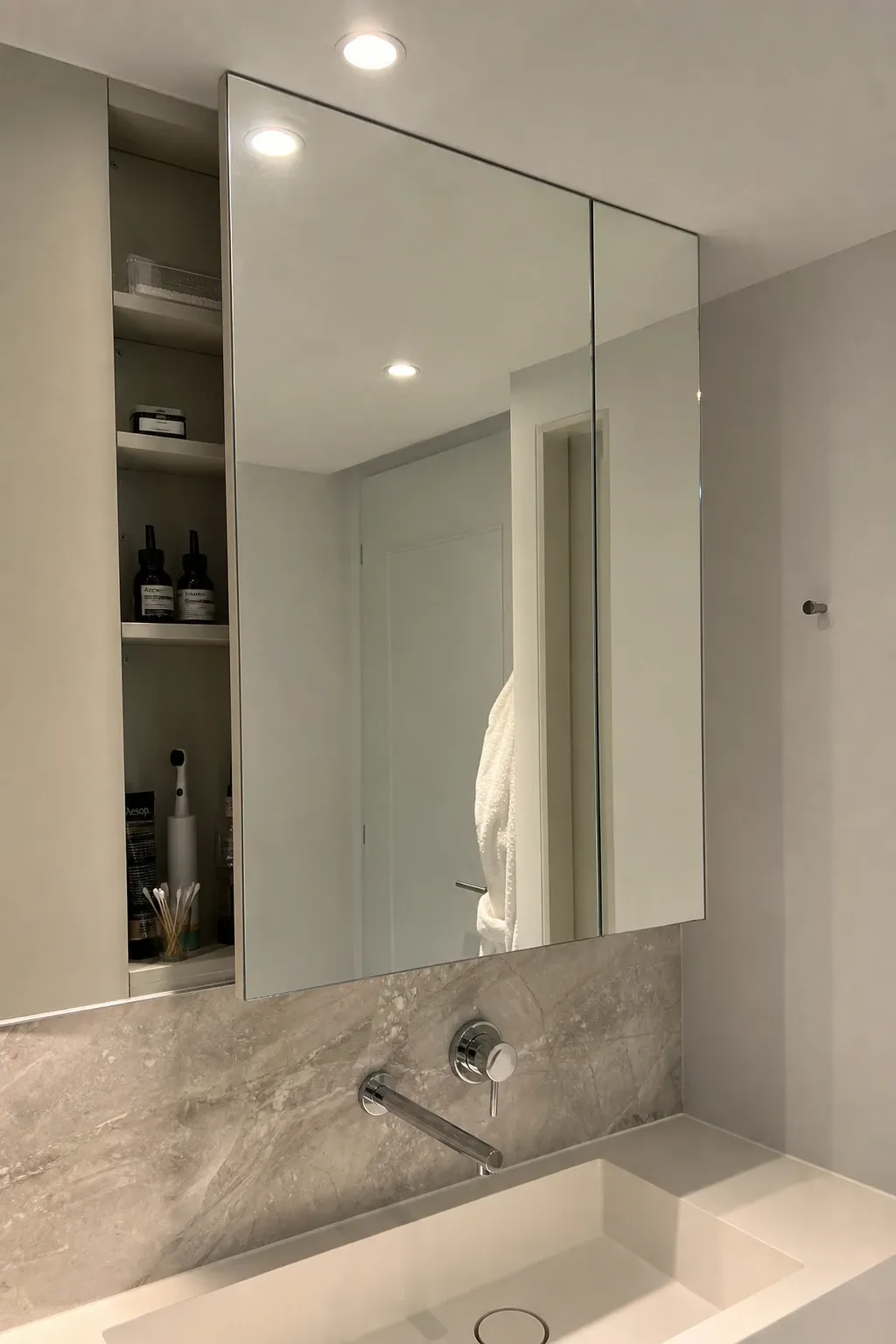 integrated storage mirror wall in a bathroom