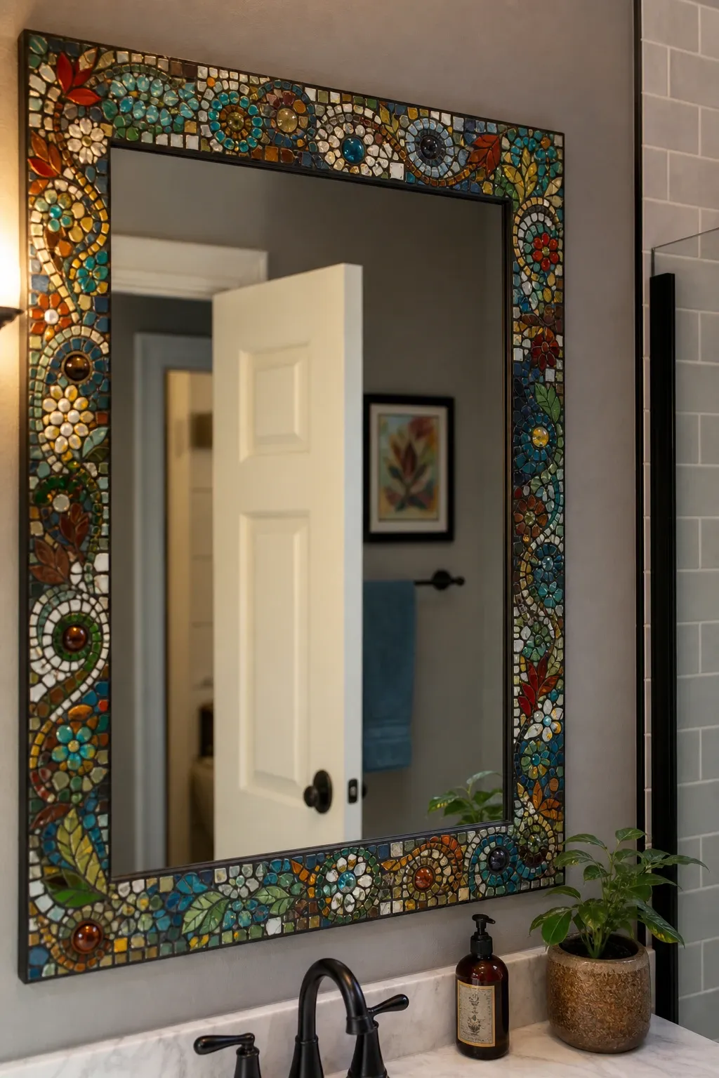 mosaic tile border mirror in a bathroom