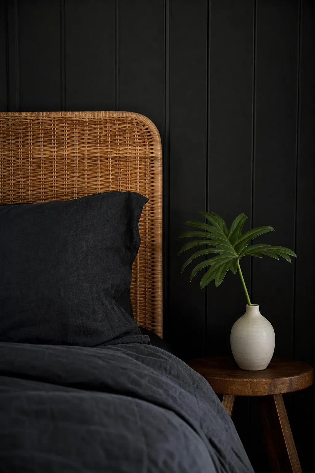 black walls with natural wood in a bedroom