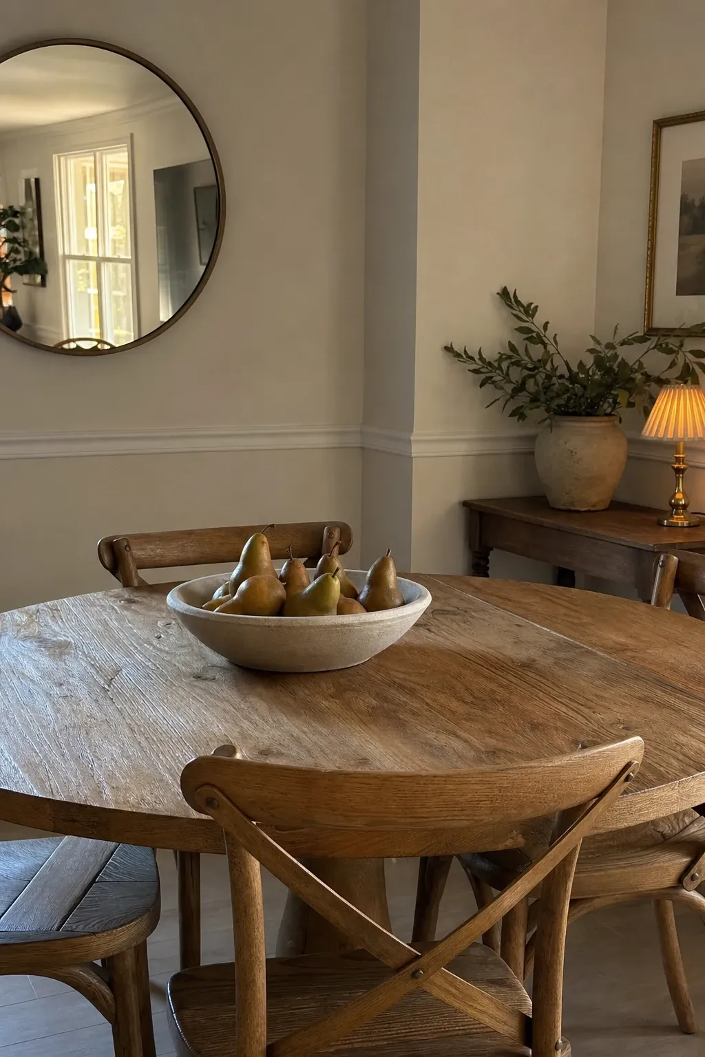 two-tone farmhouse table in a dining room