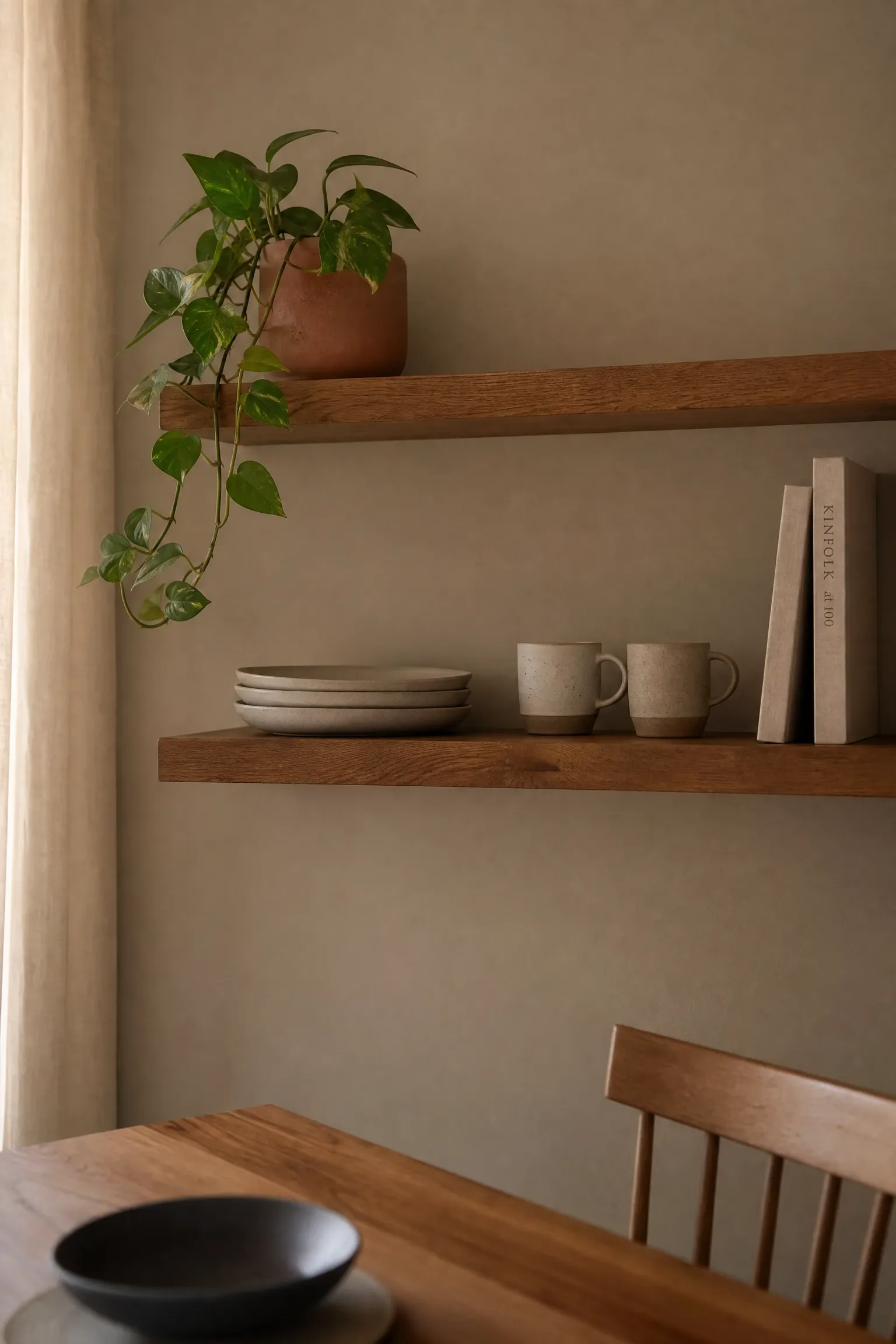 open floating shelves with intentional display in a dining room