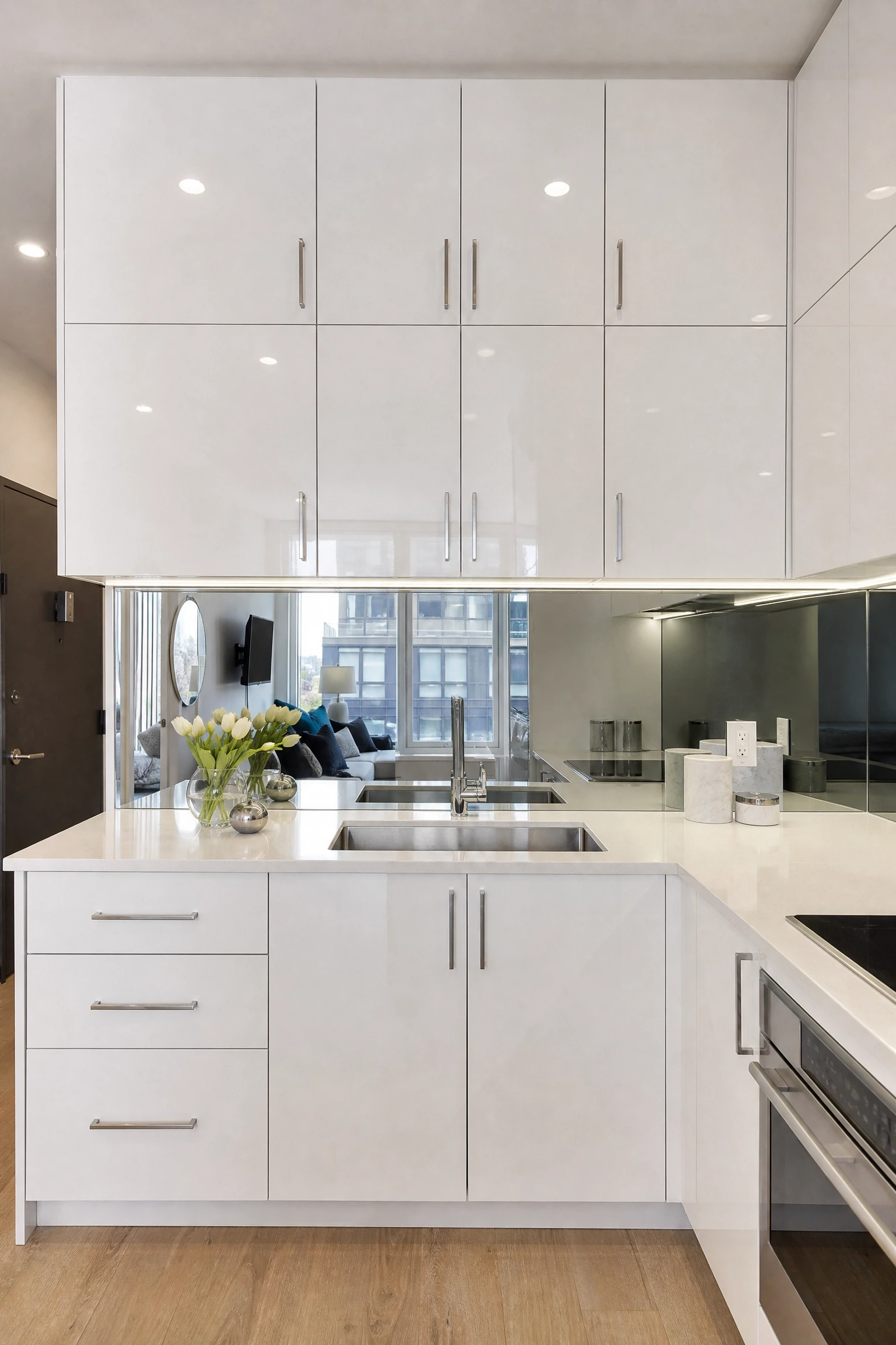 all-white high-gloss cabinets for a bright, open feel in a kitchen