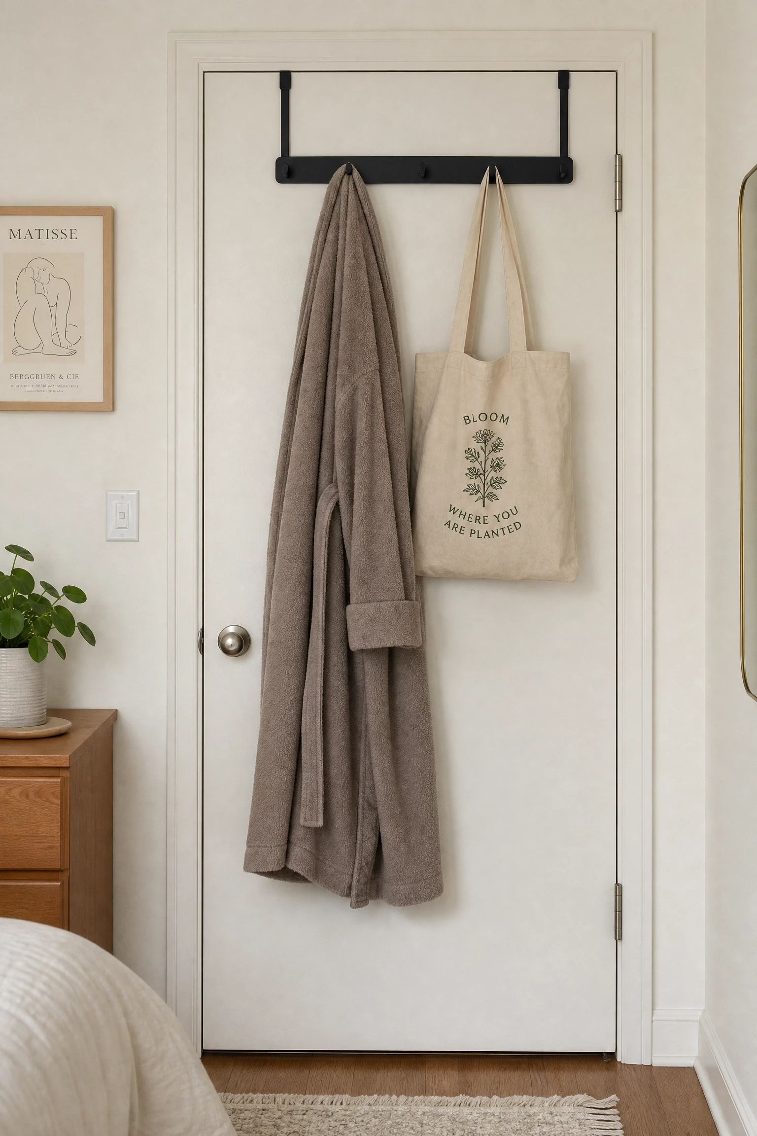 behind-the-door hooks and a slim rack in a bedroom