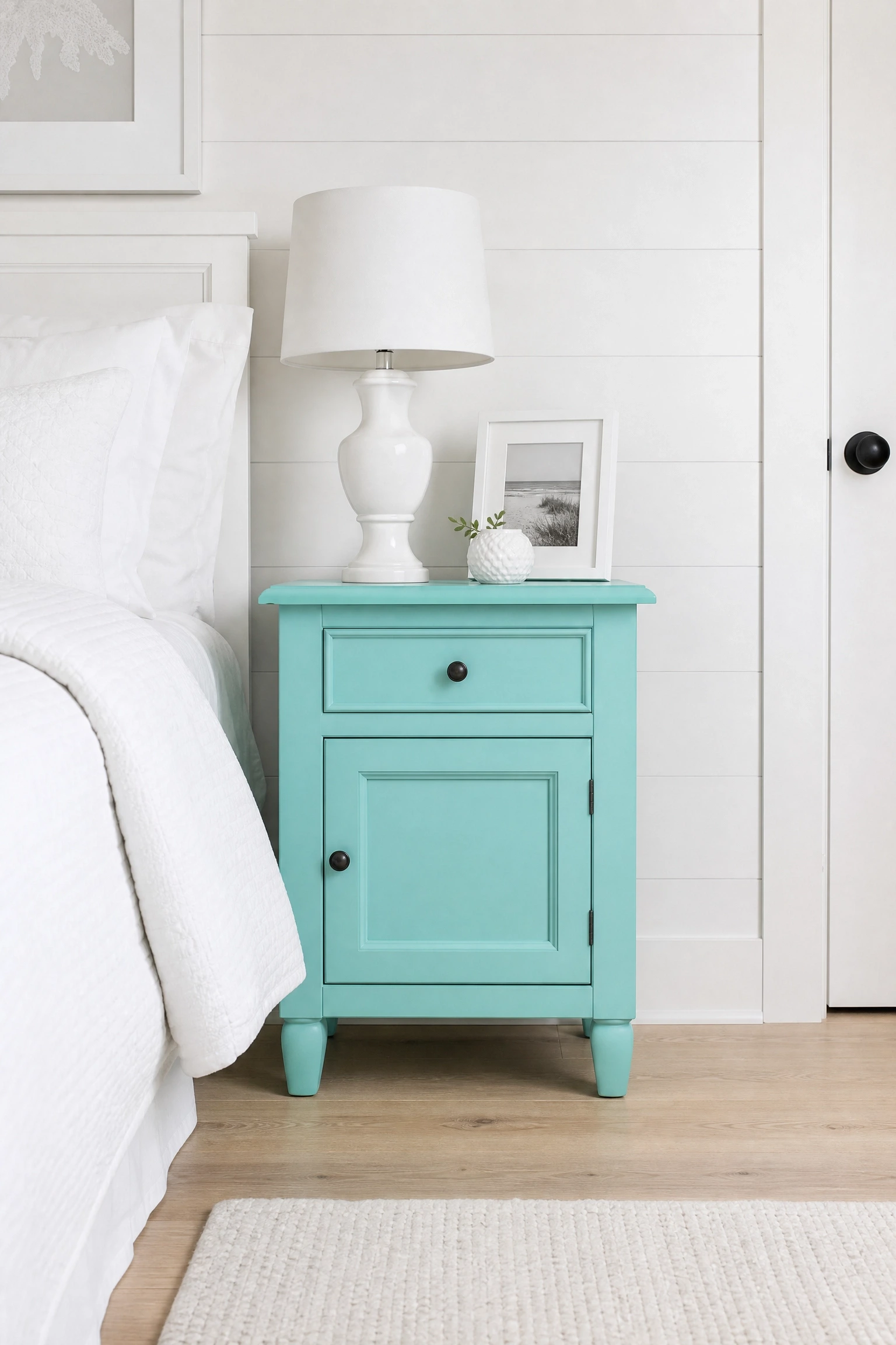 aqua furniture in a primarily white small bedroom