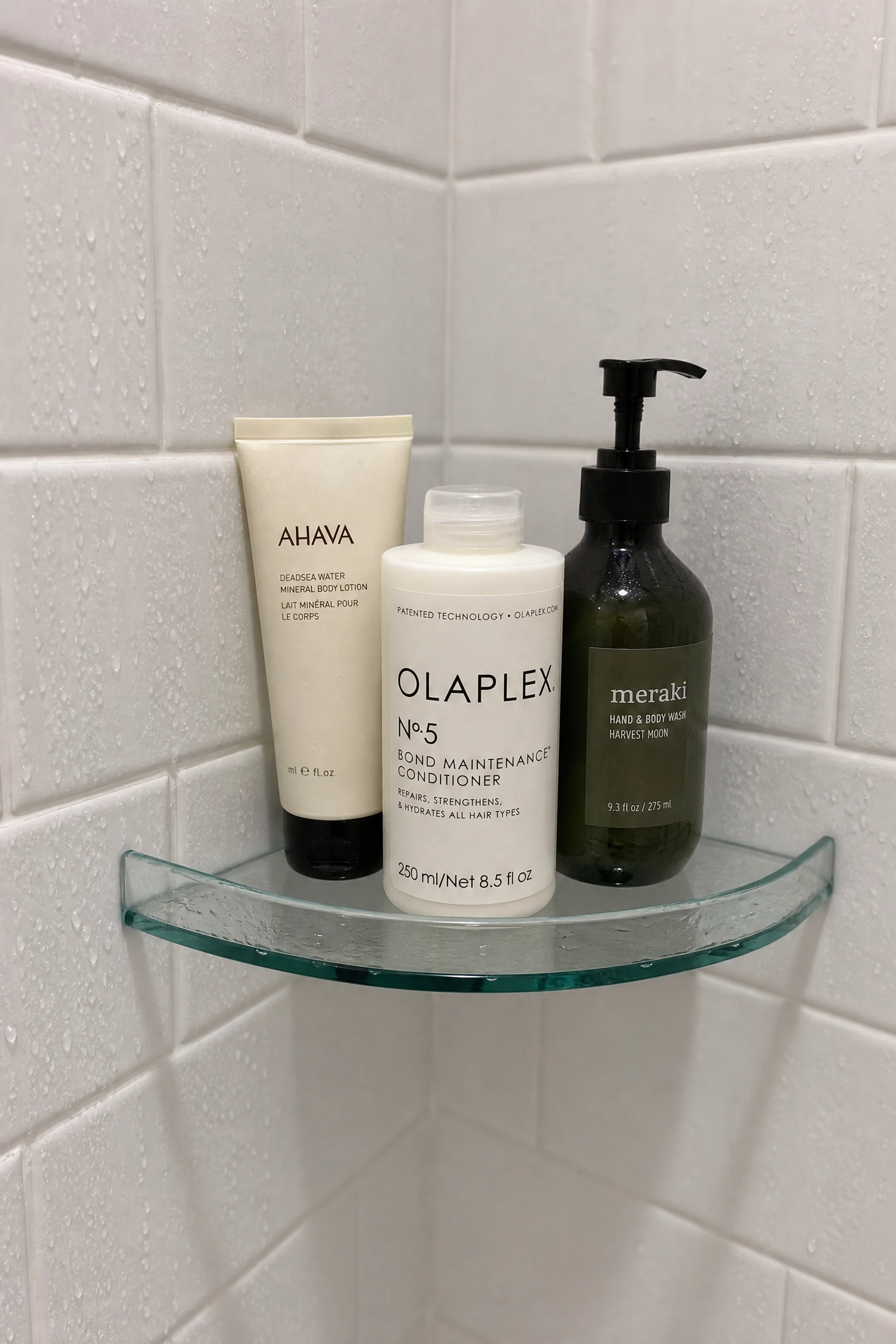 glass corner shelf in the shower in a bathroom