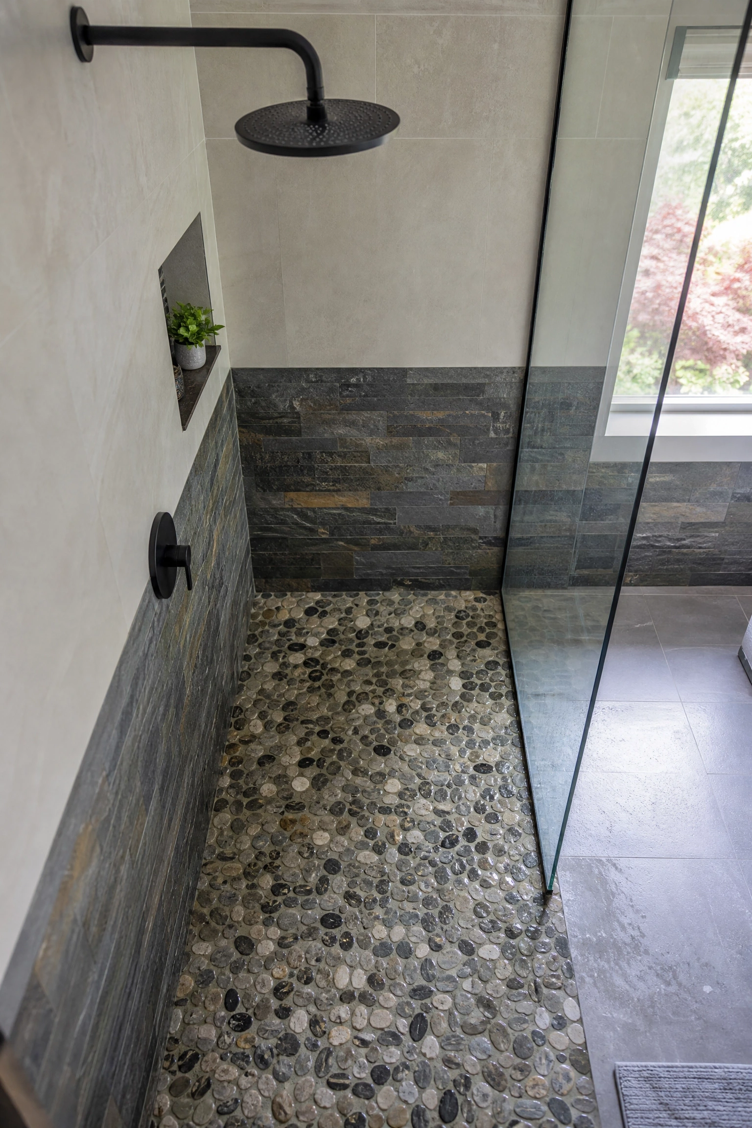 pebble or slate shower flooring in a bathroom