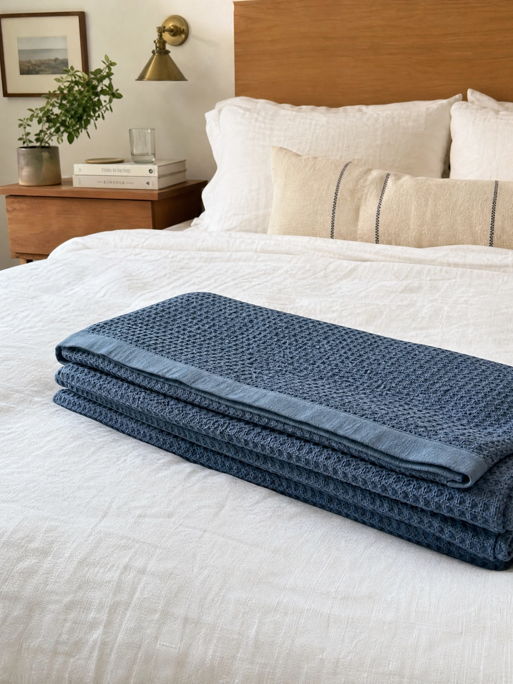 use a cotton waffle or matelasse blanket as a summer layer: feels textured, looks polished in a bedroom