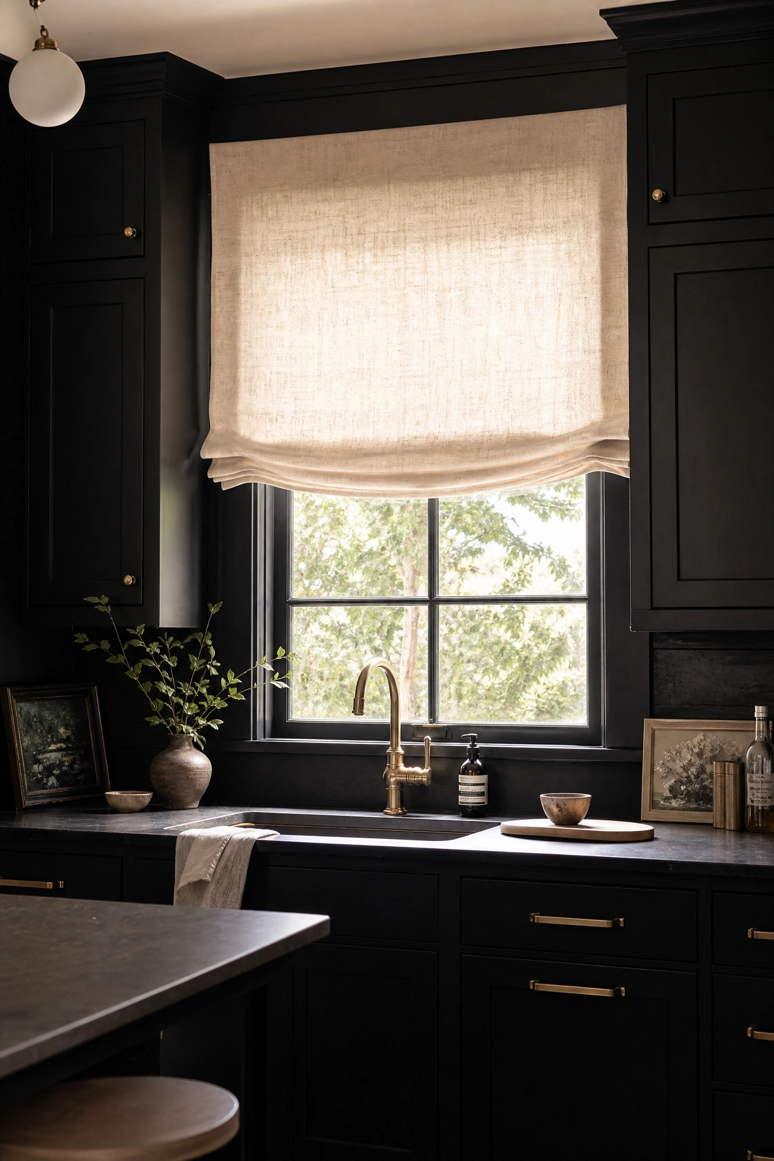 black kitchen with beige or linen roman blinds