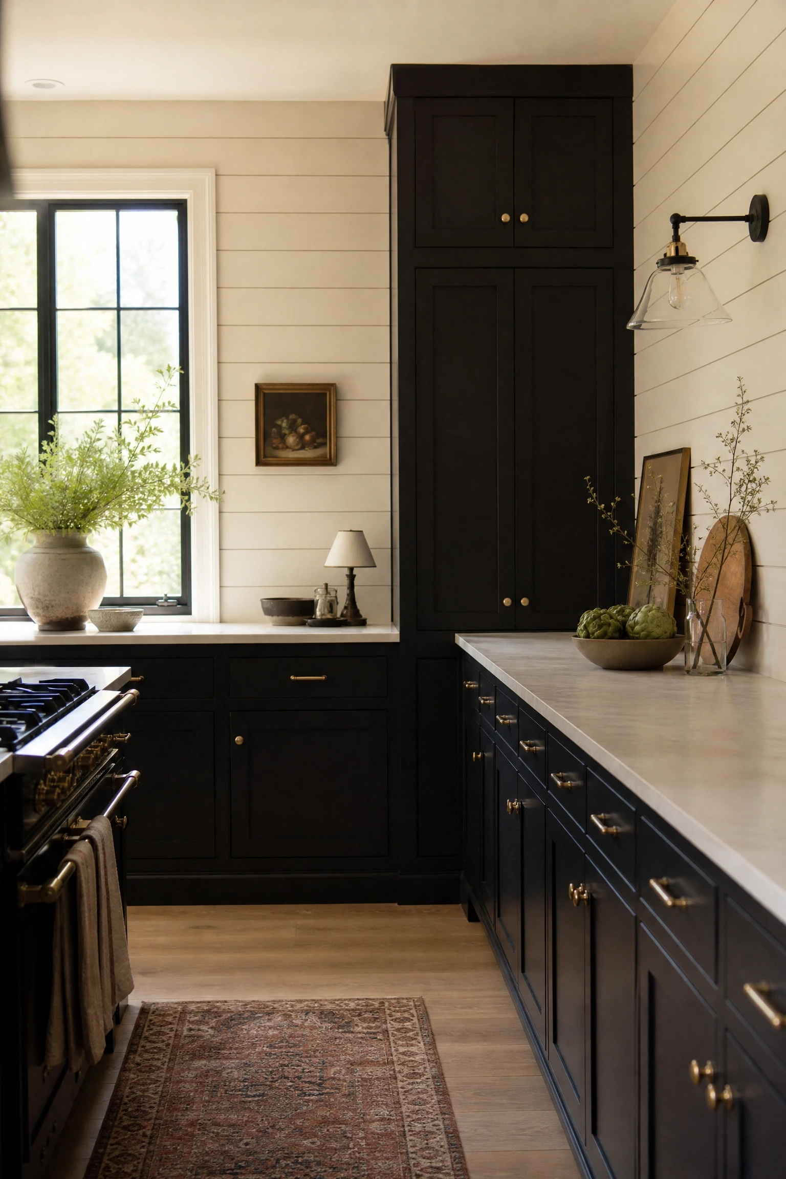 matte black cabinetry with beige shiplap or panelled walls in a kitchen