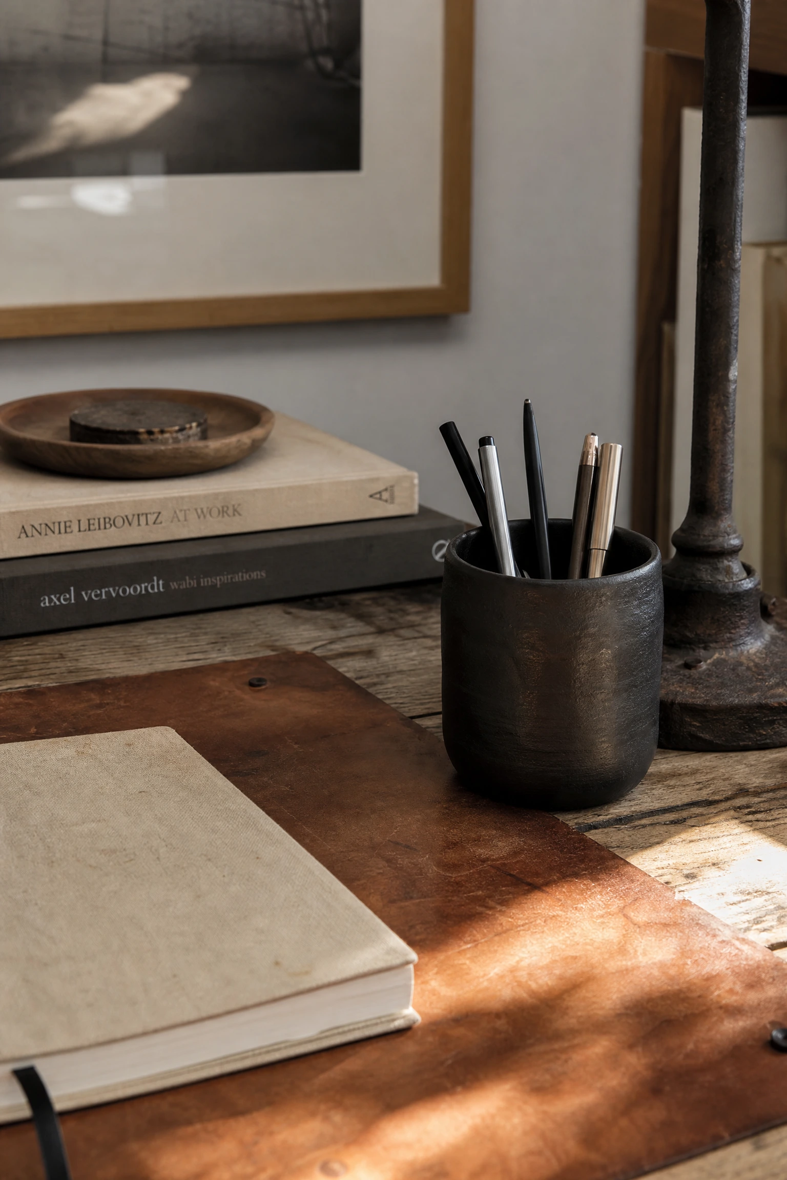 wabi-sabi in a beige and black office: celebrating imperfect textures