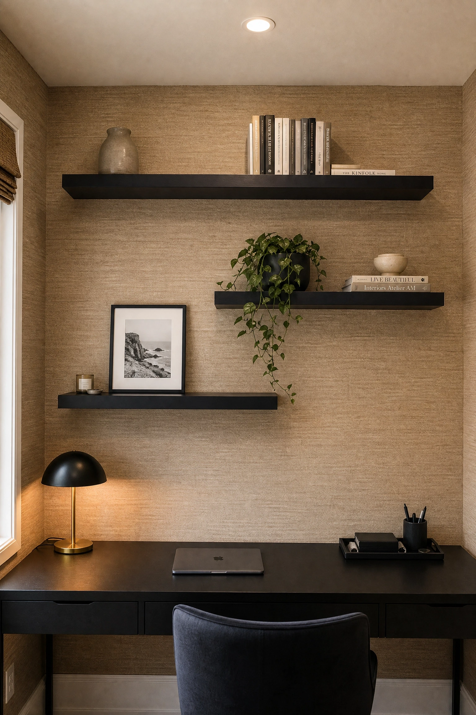 black floating shelves on a textured wall in a office