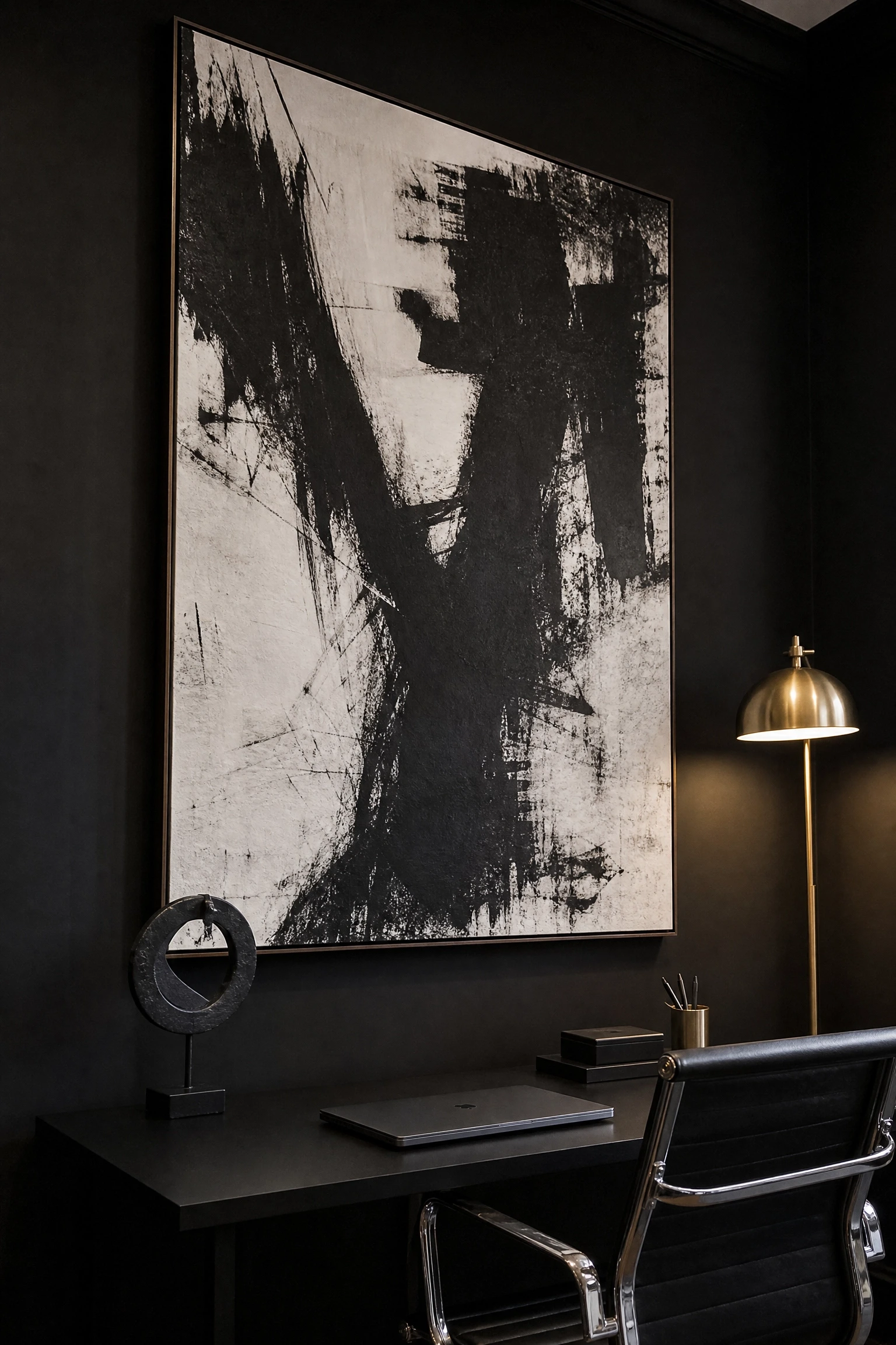 black office with oversized art