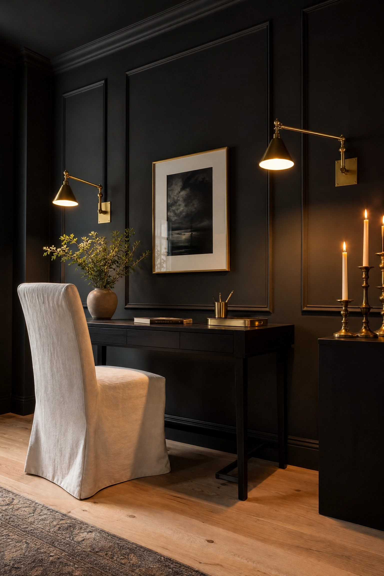 matte black walls with warm brass lighting in a office