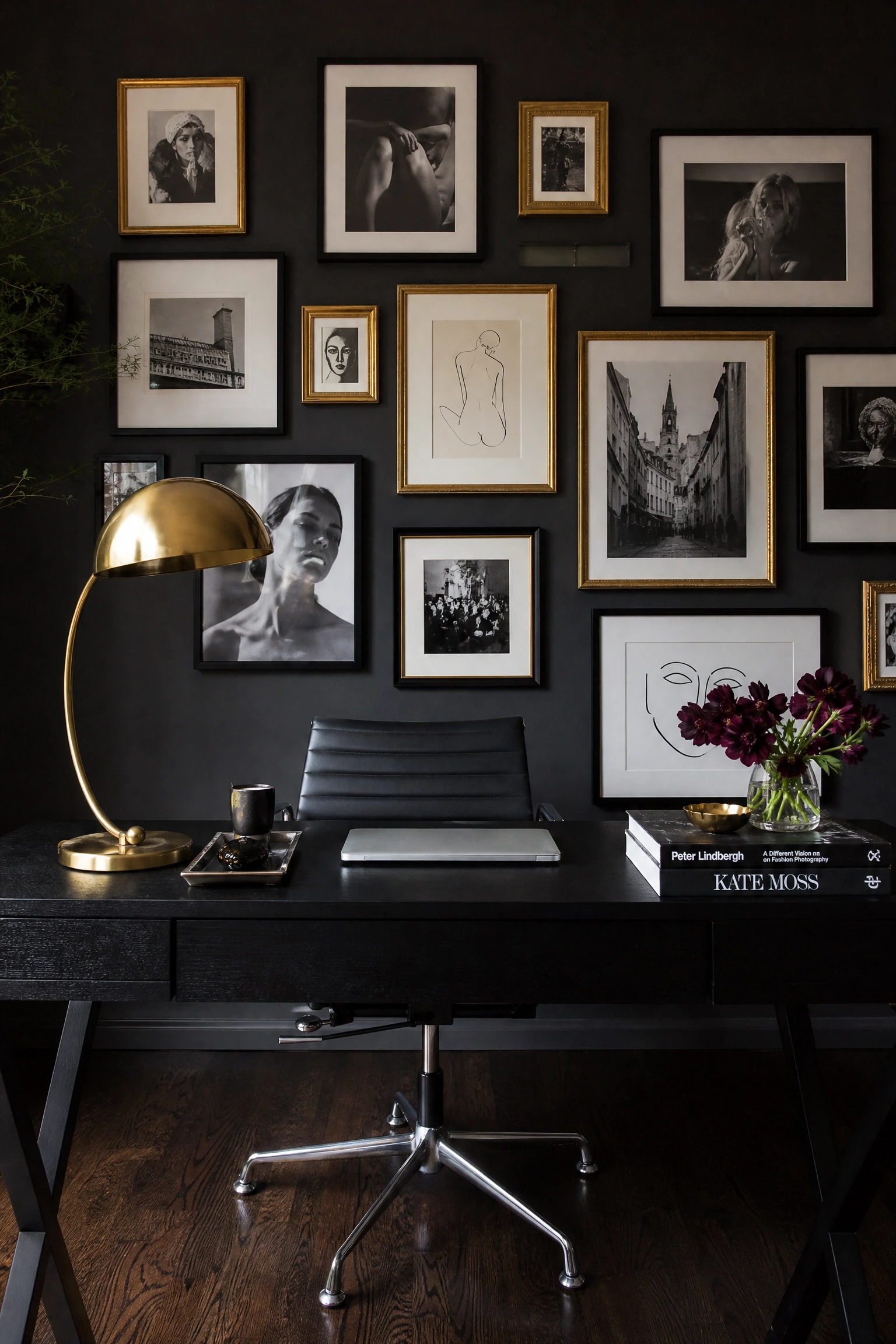 moody black office with gallery wall