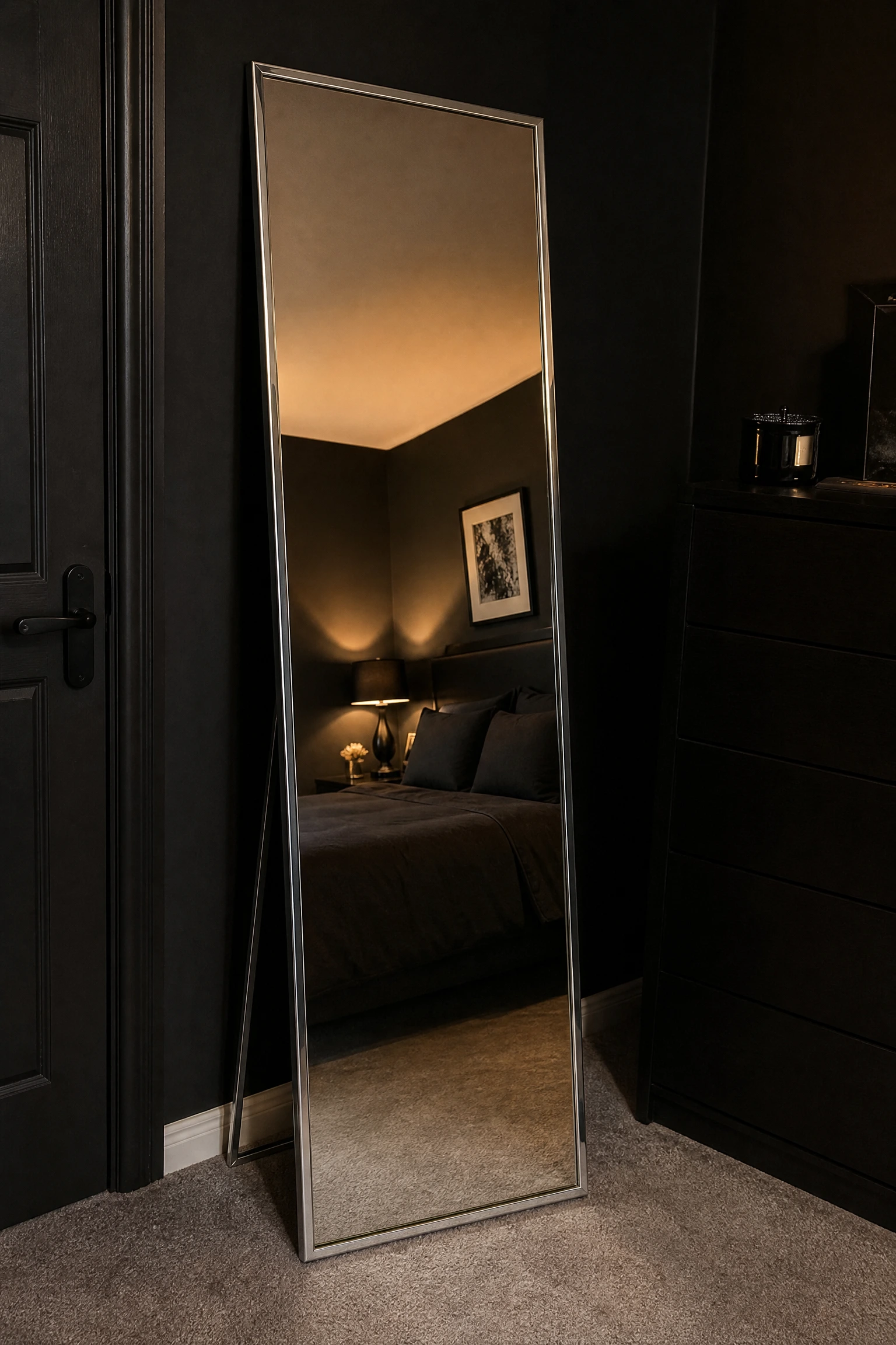 black bedroom with a silver framed dressing mirror