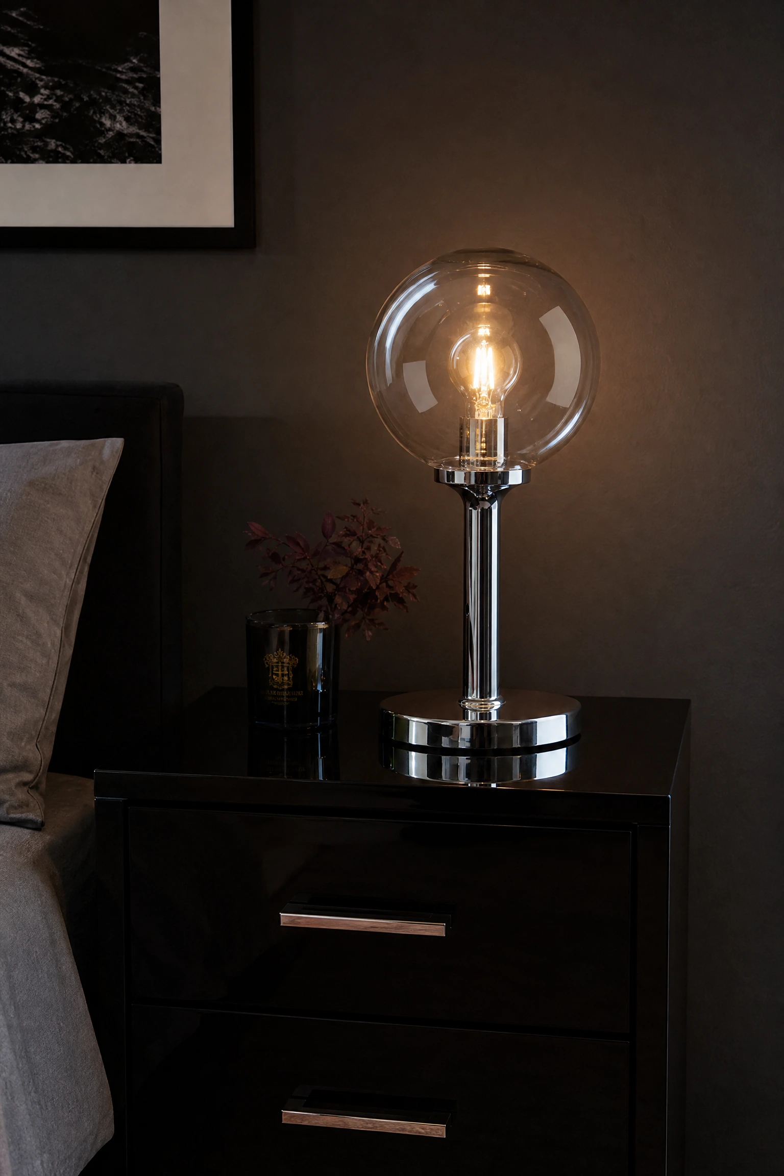 black bedroom with chrome and glass bedside lamps