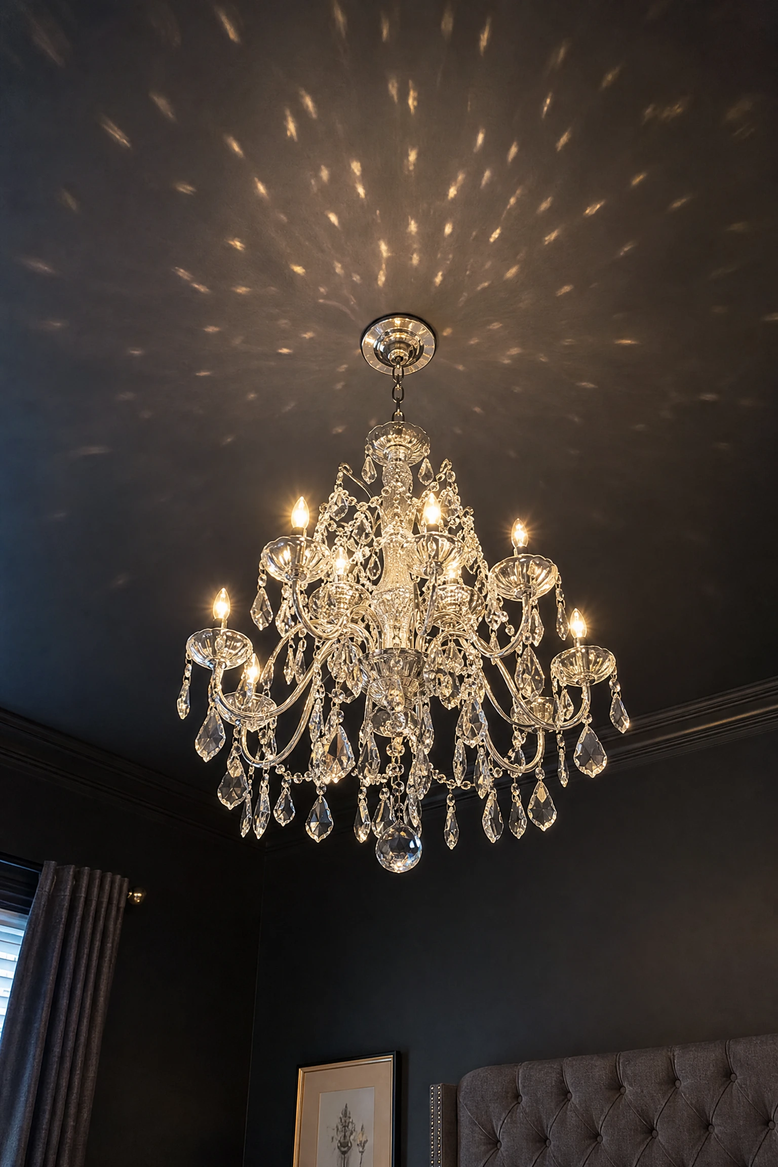 silver statement chandelier in a dark bedroom