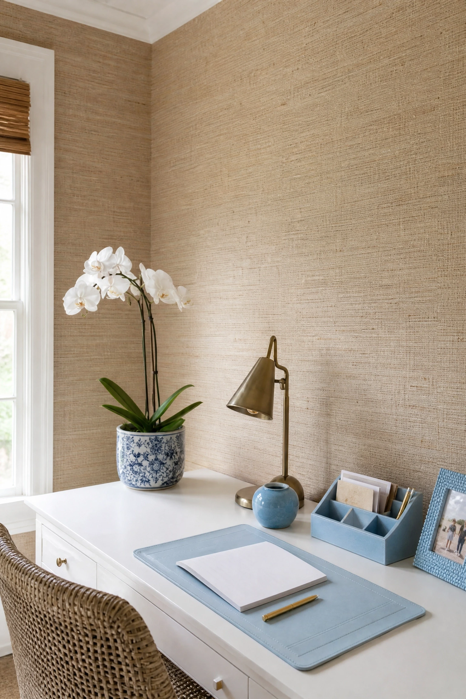 beige grasscloth wallpaper with powder blue accessories in a office