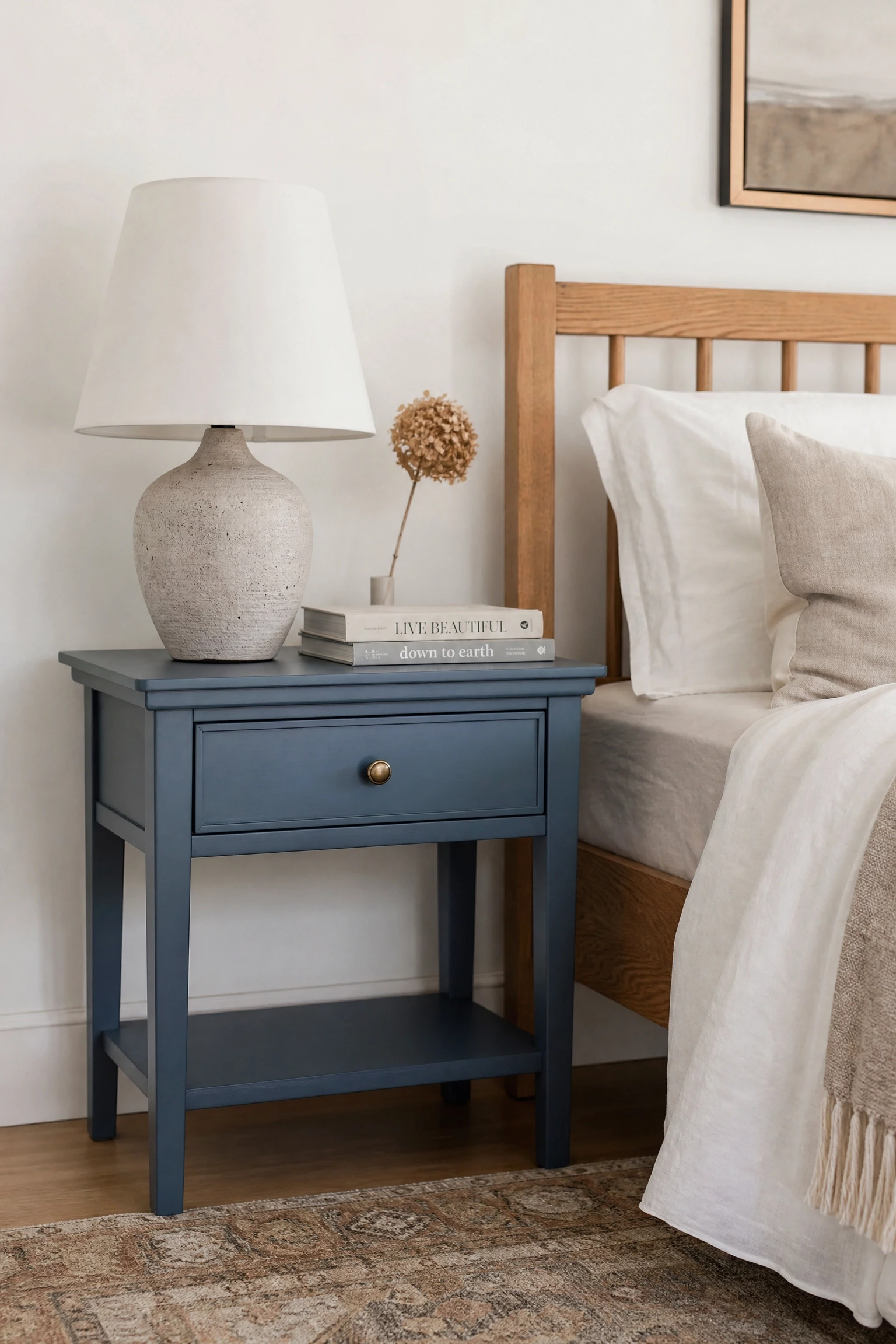 blue bedside table in a warm wood-toned room in a bedroom