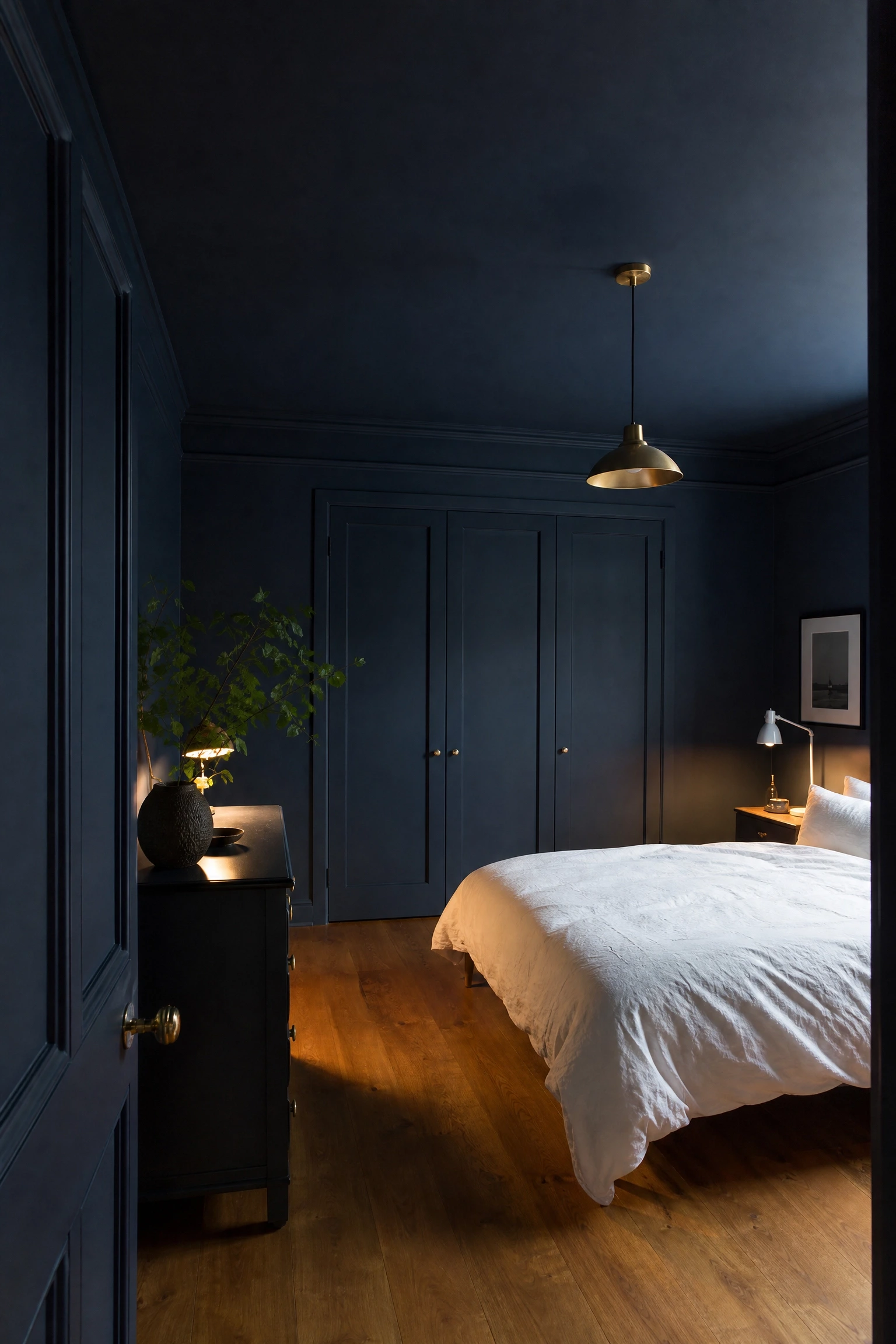 blue colour-drenched room with one warm wood floor in a bedroom