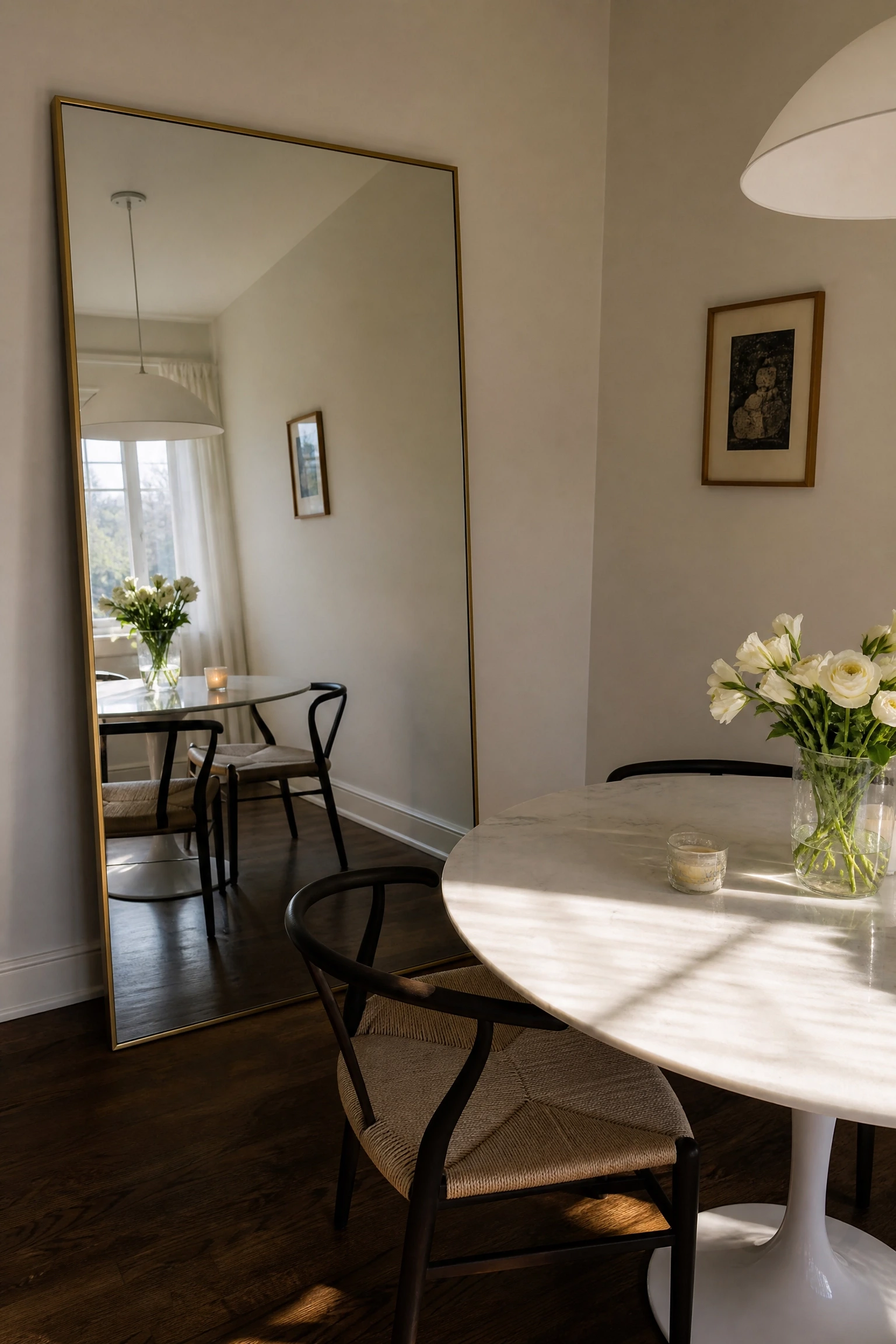 a mirror to double the perceived size of the space in a dining room