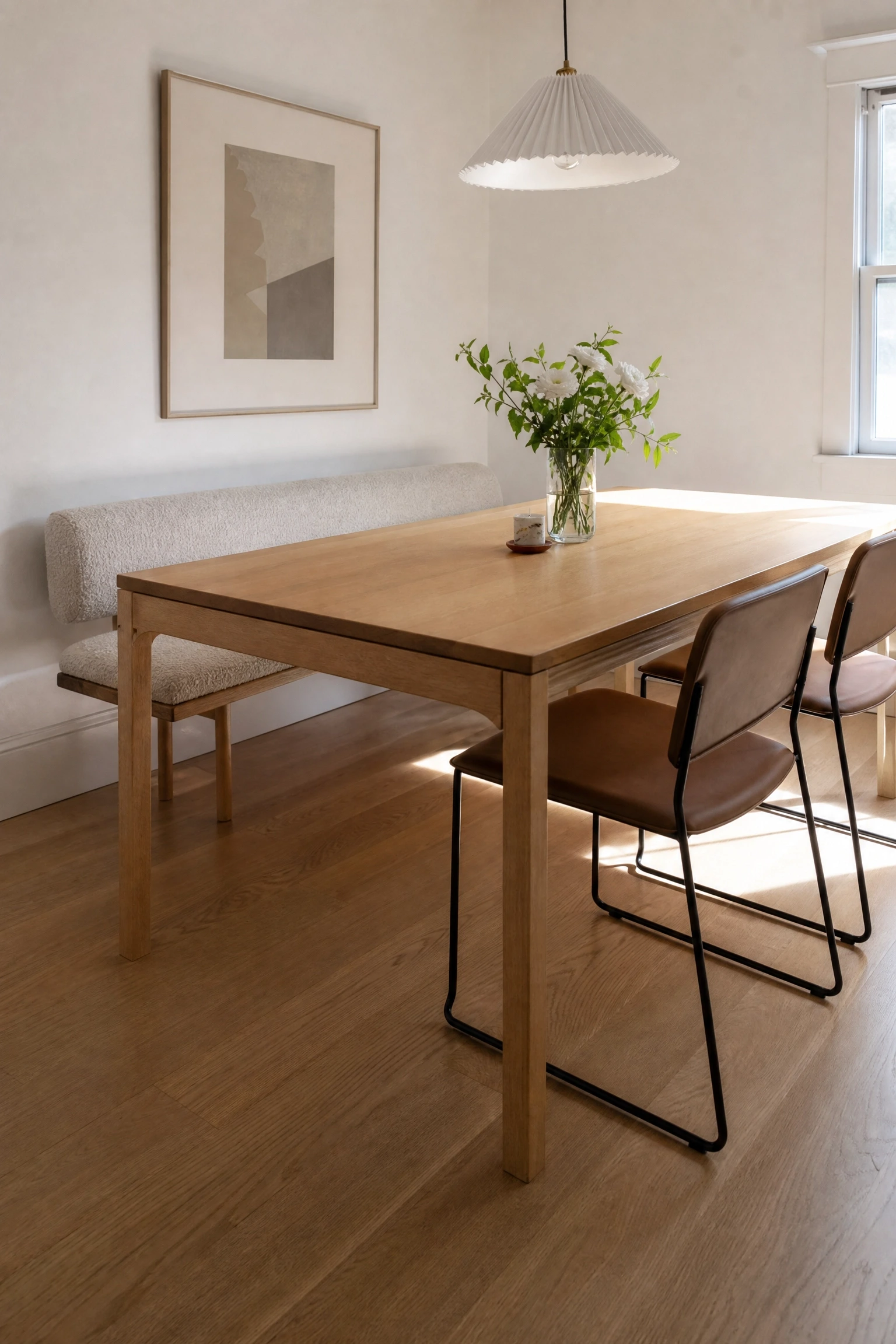 bench seating on one side to free up visual space in a dining room