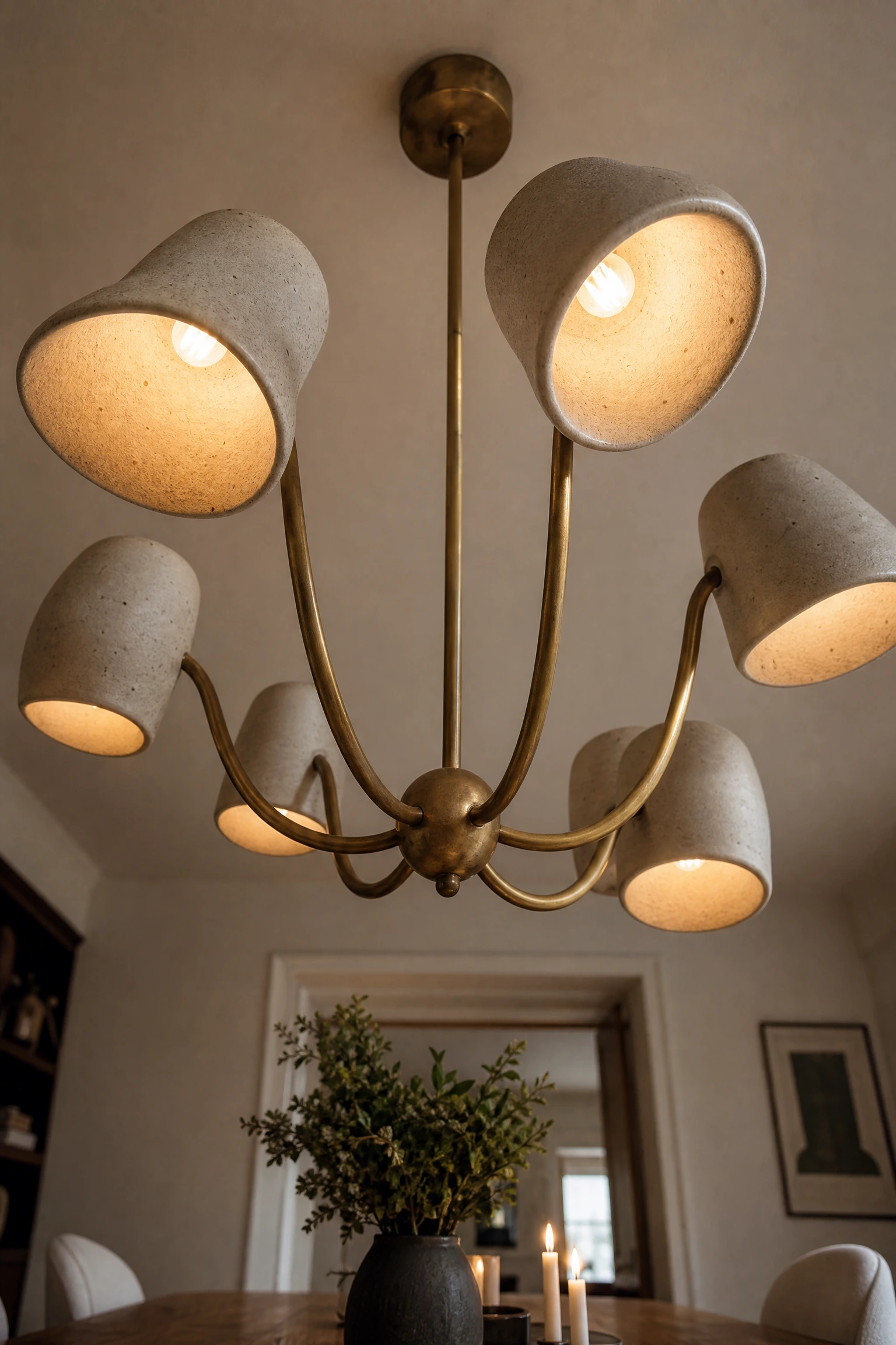 lighting is being treated as furniture, not an afterthought in a dining room