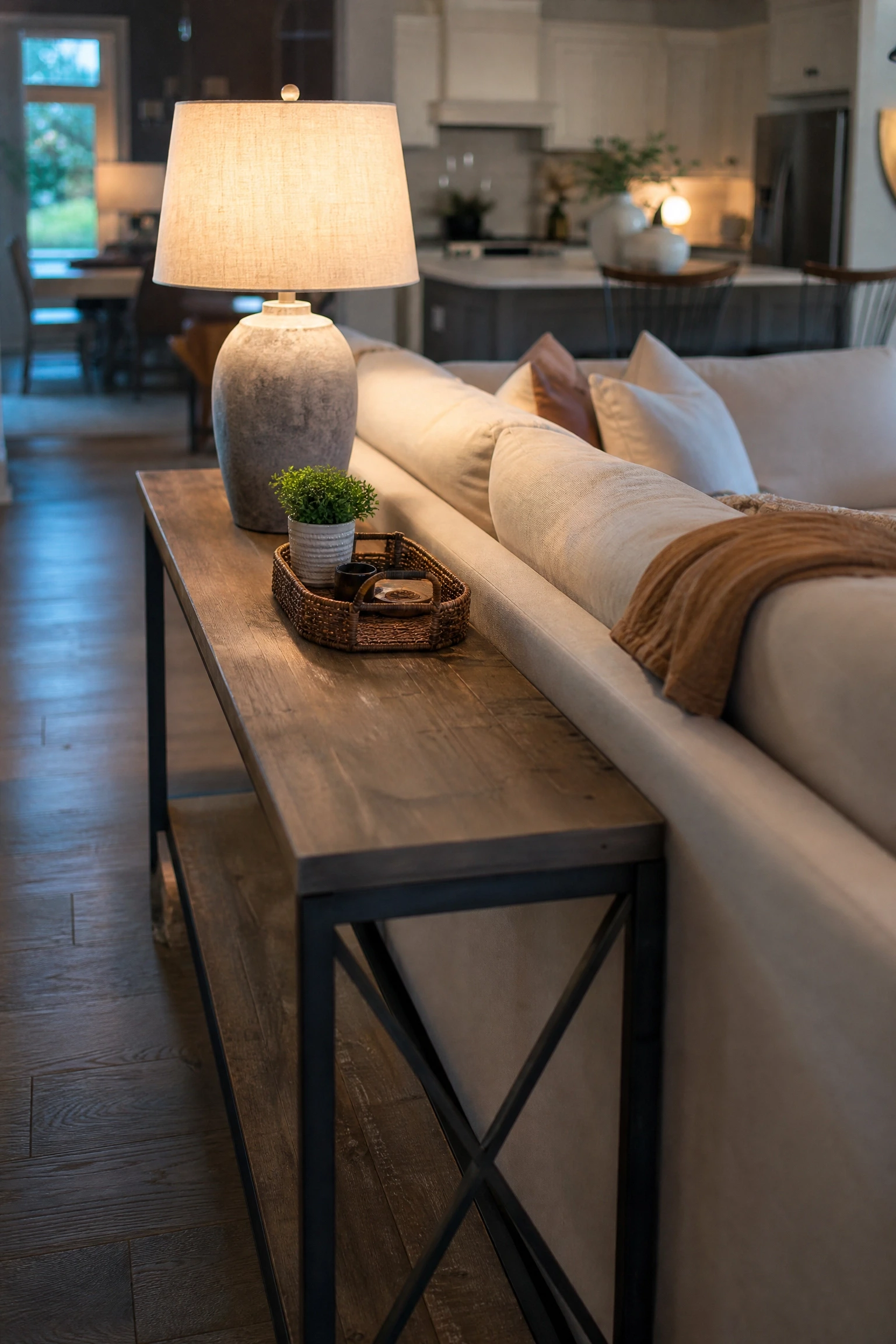 add a console table behind the sofa for extra surface in a living room