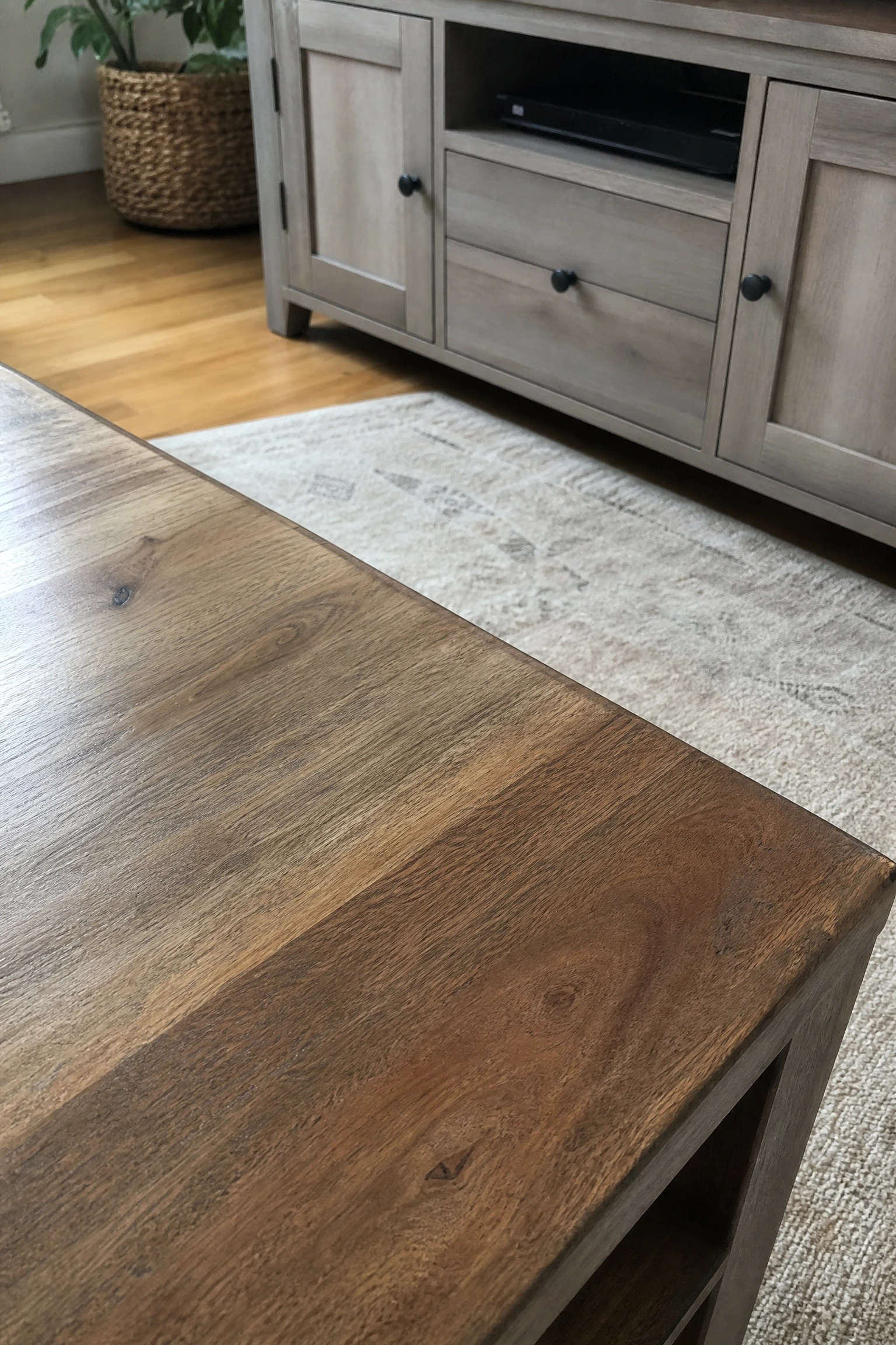 match undertones across wood finishes in a living room