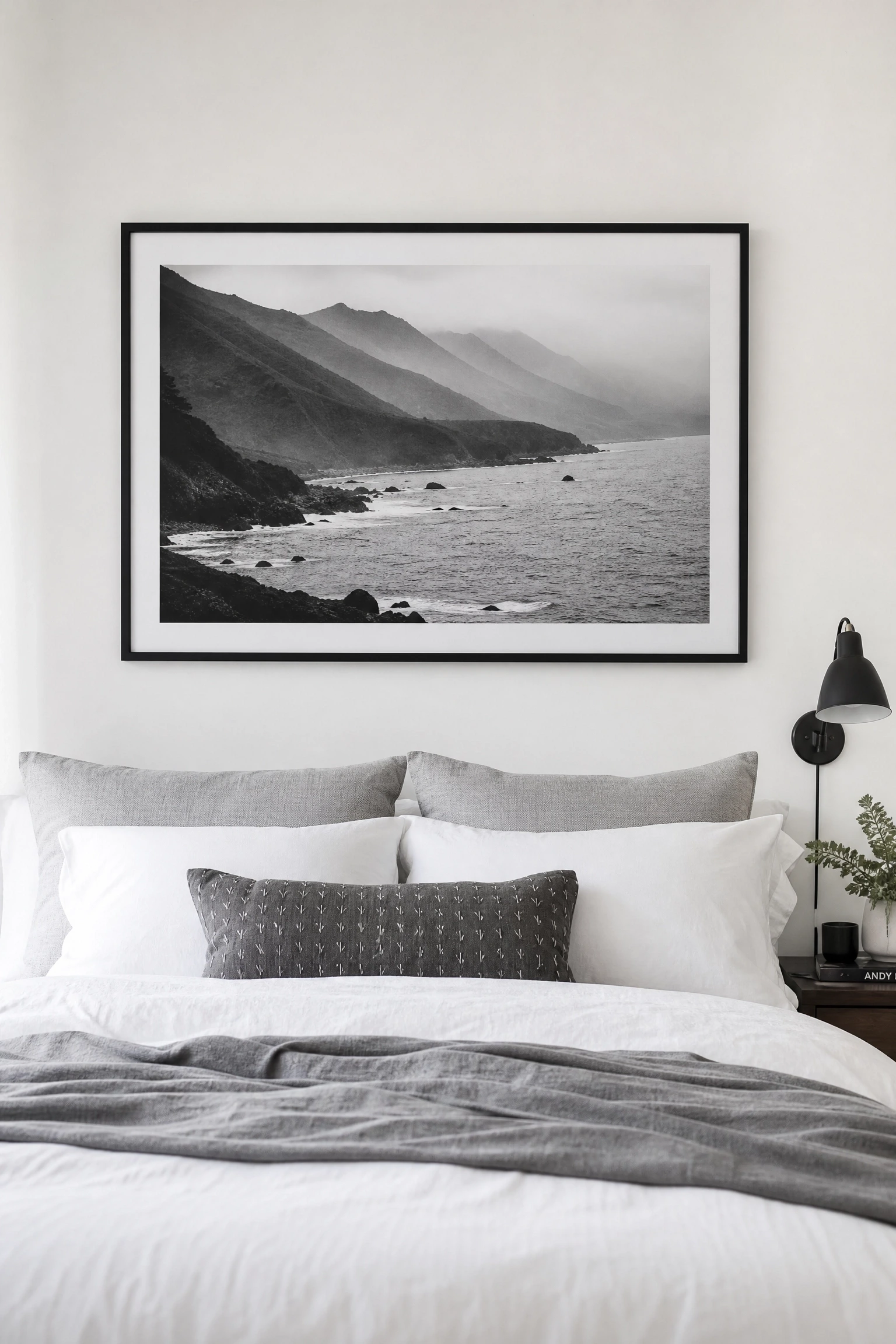 use black and white photography as the art of choice in a bedroom