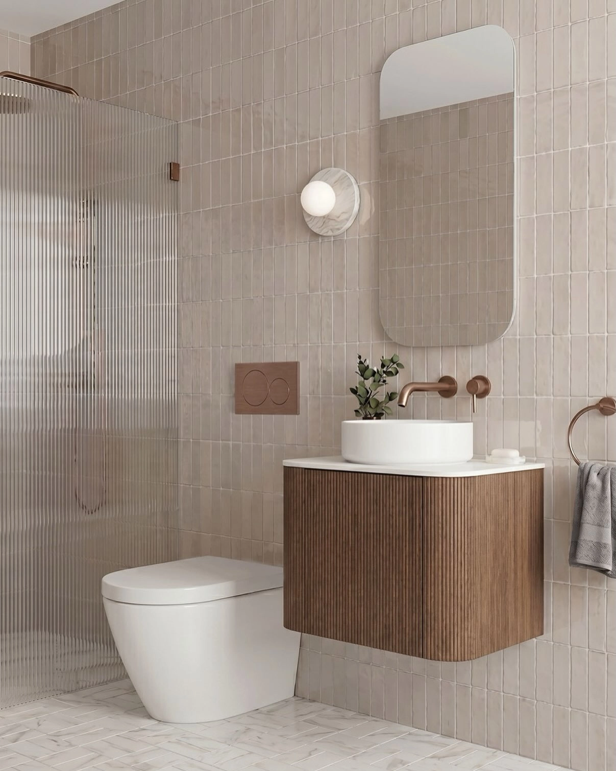 Warm beige tiled bathroom walls with white fixtures and a wood vanity